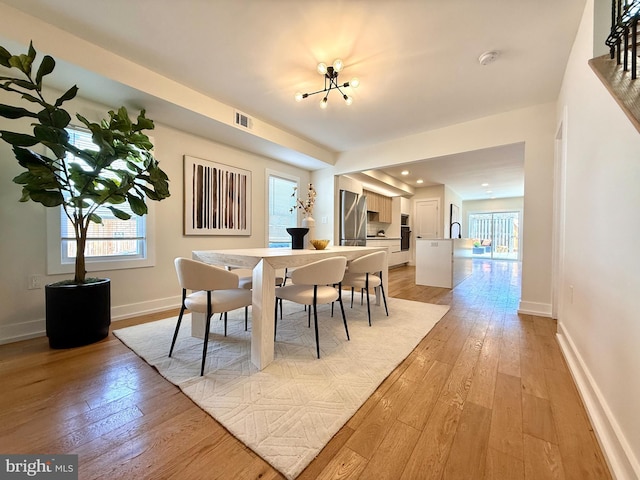 dining area featuring visible vents, recessed lighting, light wood-type flooring, and baseboards