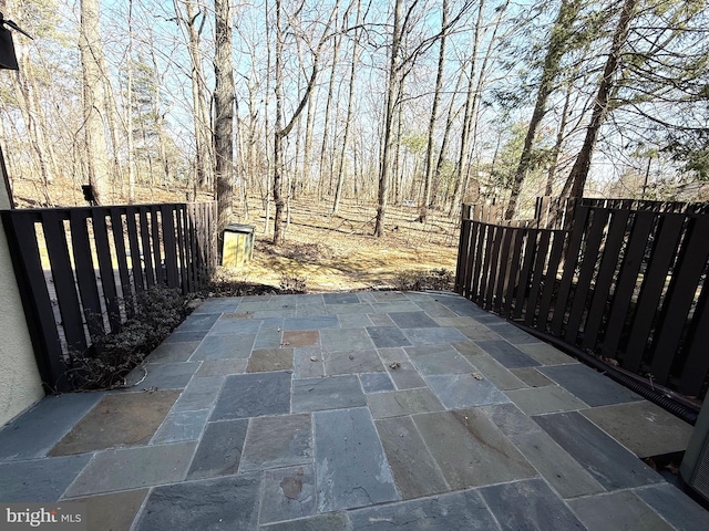 view of patio featuring fence