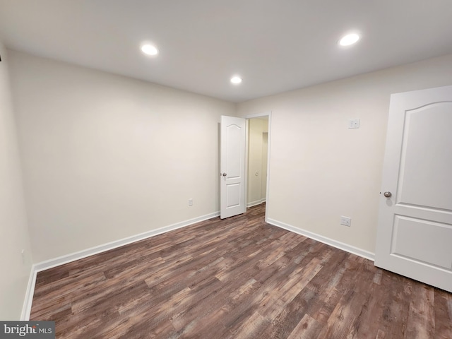 unfurnished room with recessed lighting, baseboards, and wood finished floors