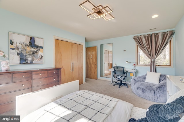 bedroom with light carpet and visible vents