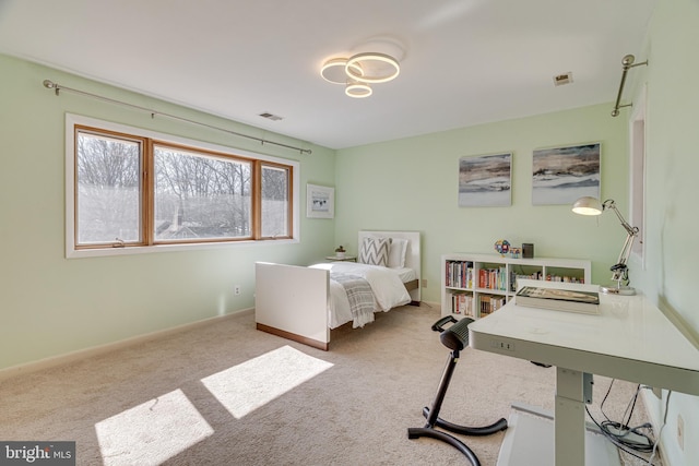 bedroom with visible vents, carpet floors, and baseboards