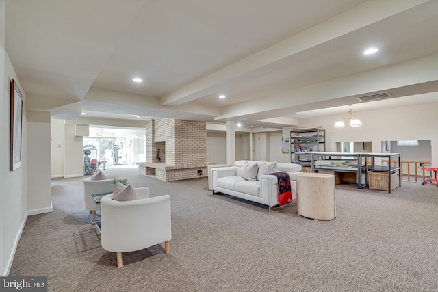 living room featuring a brick fireplace, carpet flooring, recessed lighting, and visible vents