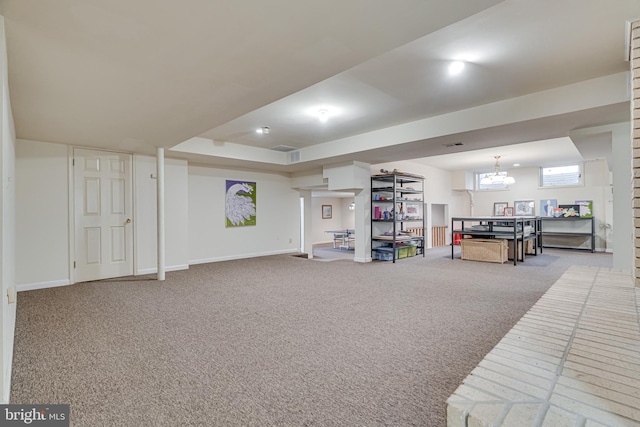 interior space featuring carpet flooring and baseboards