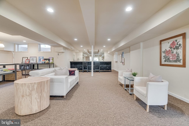 living area featuring recessed lighting and carpet