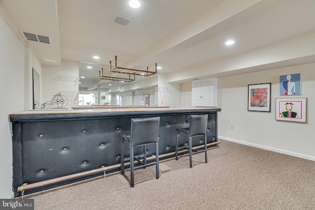 kitchen with recessed lighting, visible vents, carpet floors, and baseboards