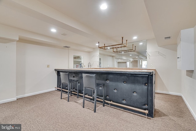 kitchen with carpet flooring, recessed lighting, and baseboards