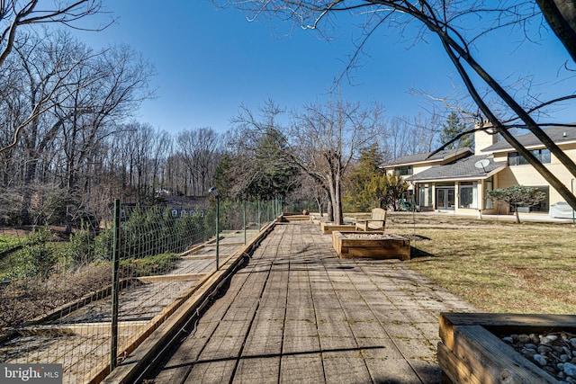 exterior space featuring a yard, a fire pit, and fence