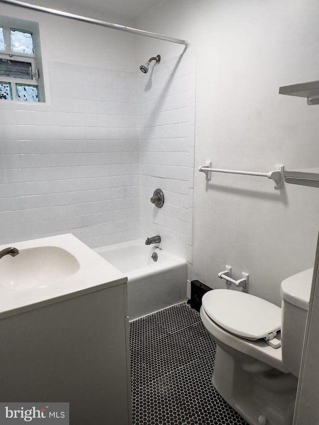 full bath featuring toilet, shower / washtub combination, vanity, and tile patterned flooring