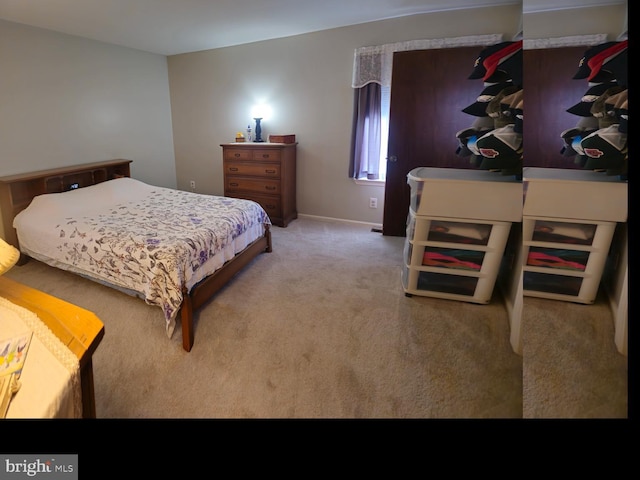 carpeted bedroom featuring baseboards