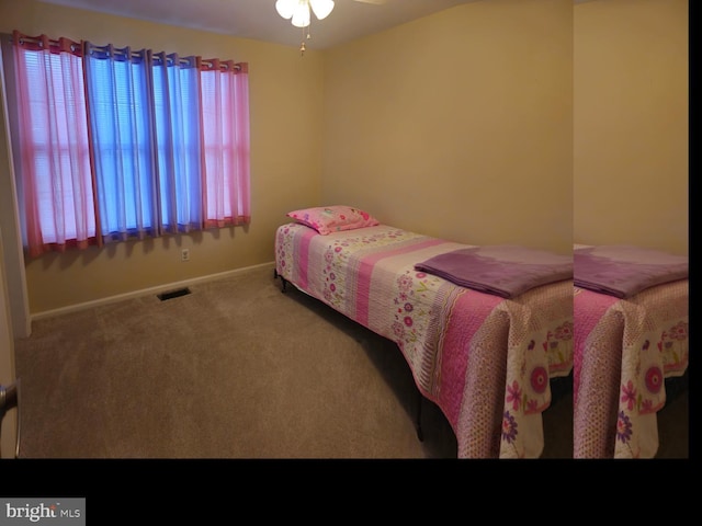 carpeted bedroom featuring visible vents and baseboards