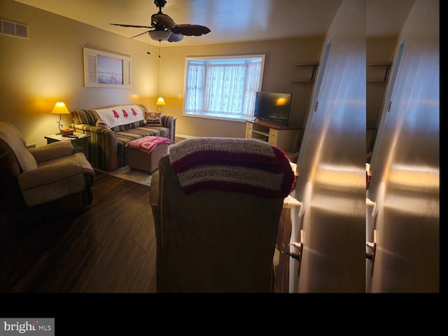 interior space with dark wood-style floors, visible vents, and ceiling fan