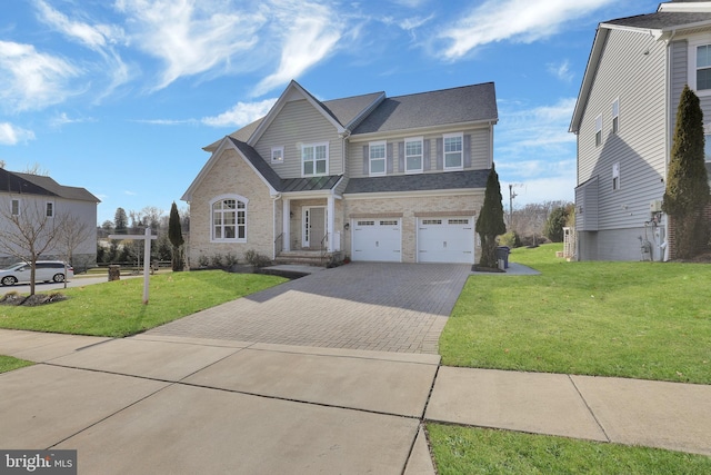 view of front of home with a garage, decorative driveway, and a front lawn