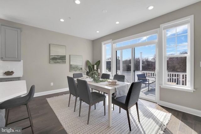 dining area featuring recessed lighting, baseboards, and wood finished floors