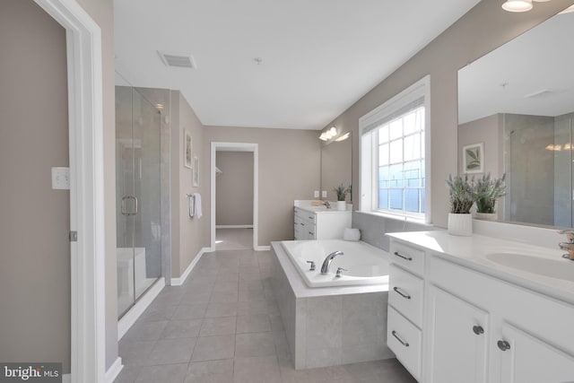 full bathroom with a sink, a stall shower, tile patterned floors, and a bath