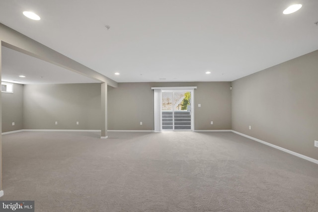 basement with recessed lighting, baseboards, and carpet flooring