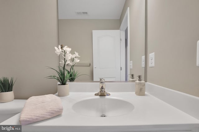 bathroom with visible vents and vanity