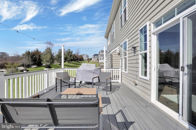 wooden deck with grilling area