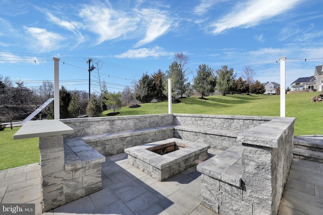 view of patio featuring an outdoor fire pit