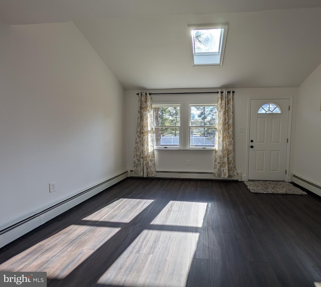 entryway with vaulted ceiling with skylight, wood finished floors, and baseboard heating