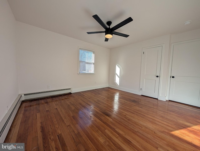 unfurnished bedroom with a baseboard radiator, baseboards, hardwood / wood-style floors, and a ceiling fan