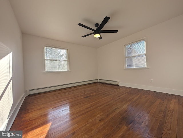 empty room featuring hardwood / wood-style floors, plenty of natural light, a ceiling fan, and baseboard heating