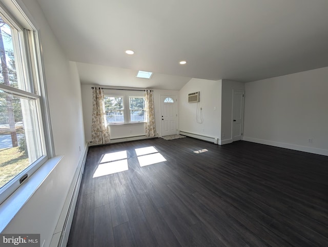 unfurnished living room featuring baseboards, a wall mounted air conditioner, baseboard heating, recessed lighting, and dark wood-style floors