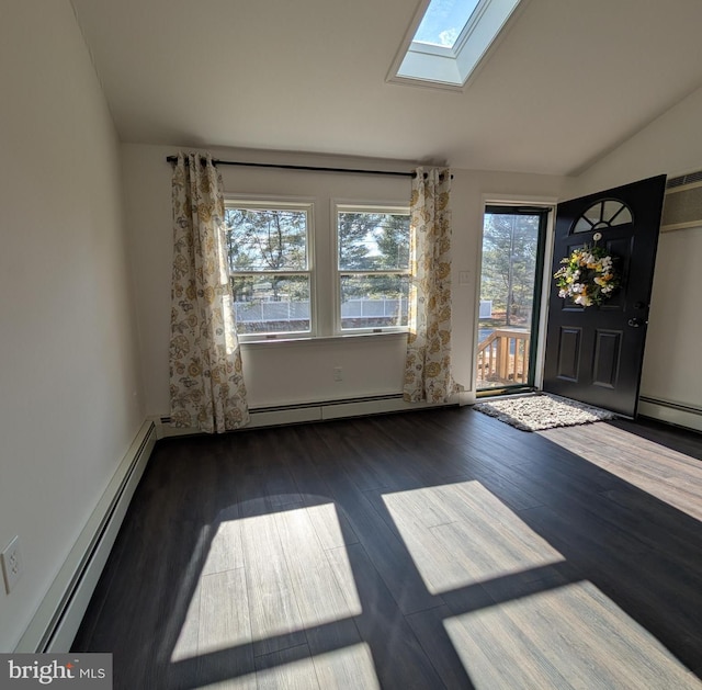 interior space with a baseboard radiator, vaulted ceiling with skylight, and wood finished floors