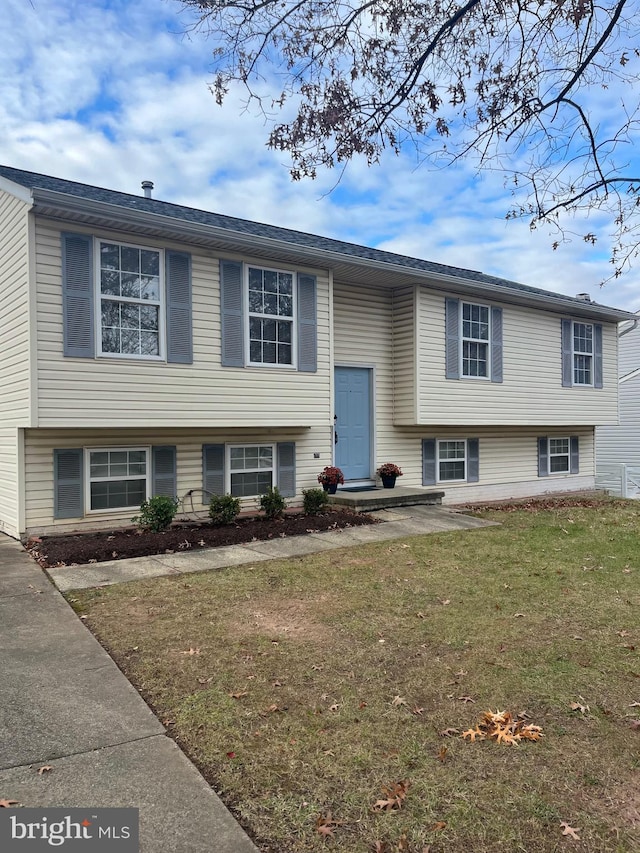 bi-level home with a front yard