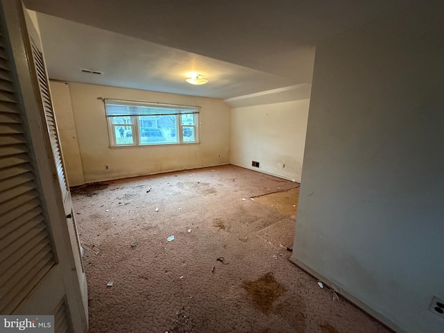 unfurnished bedroom featuring visible vents