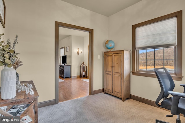 office area with baseboards and light colored carpet