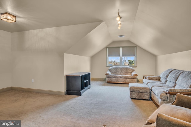 living room with visible vents, lofted ceiling, carpet, and baseboards