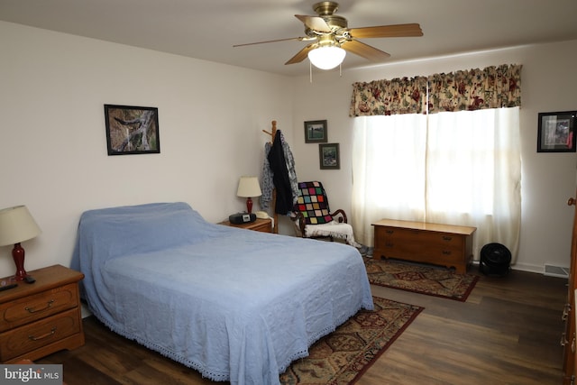 bedroom with visible vents, ceiling fan, and wood finished floors