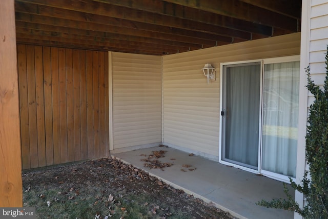 doorway to property with a patio area