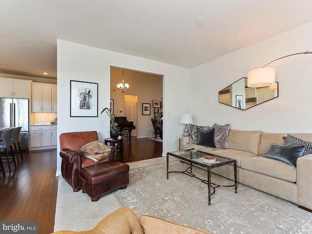 living room featuring a notable chandelier and hardwood / wood-style flooring