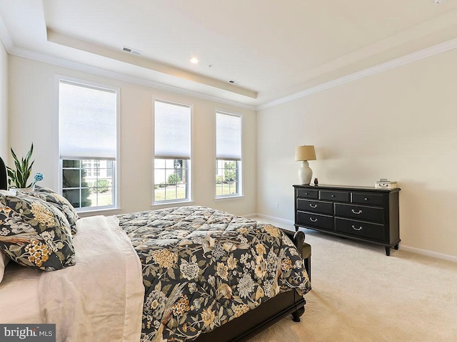 bedroom with visible vents, baseboards, light colored carpet, and ornamental molding