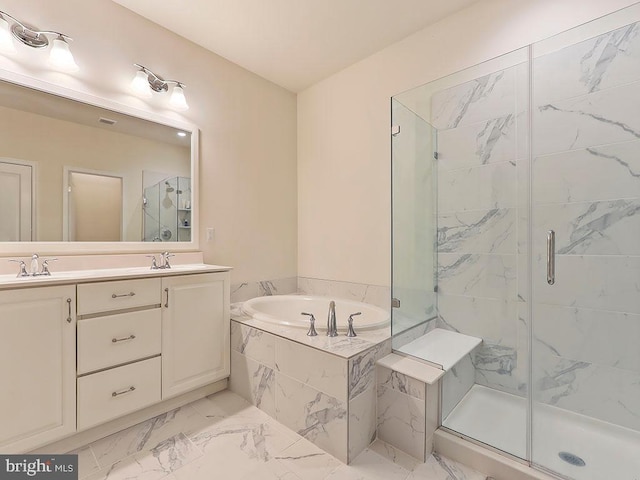 full bath with a shower stall, marble finish floor, and a garden tub