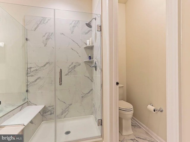 full bath with baseboards, toilet, marble finish floor, and a shower stall