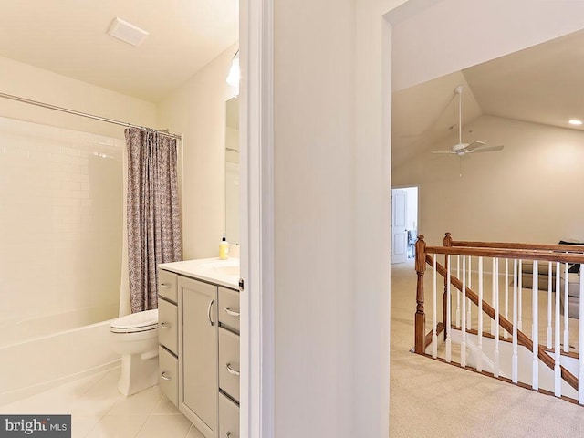 bathroom featuring vanity, ceiling fan, shower / bath combination with curtain, vaulted ceiling, and toilet