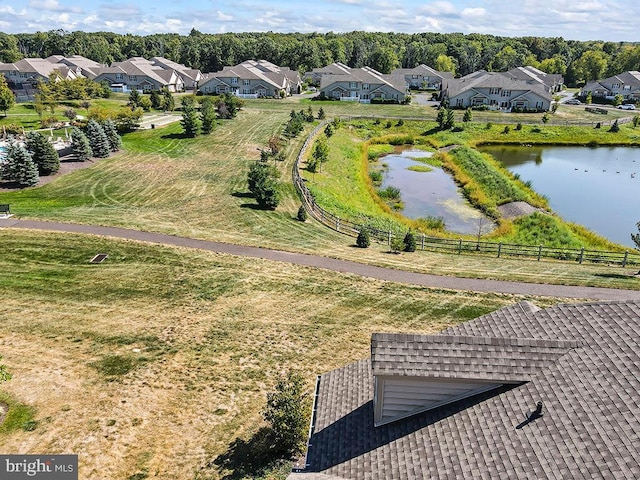 birds eye view of property with a residential view and a water view