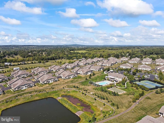 birds eye view of property with a residential view and a water view