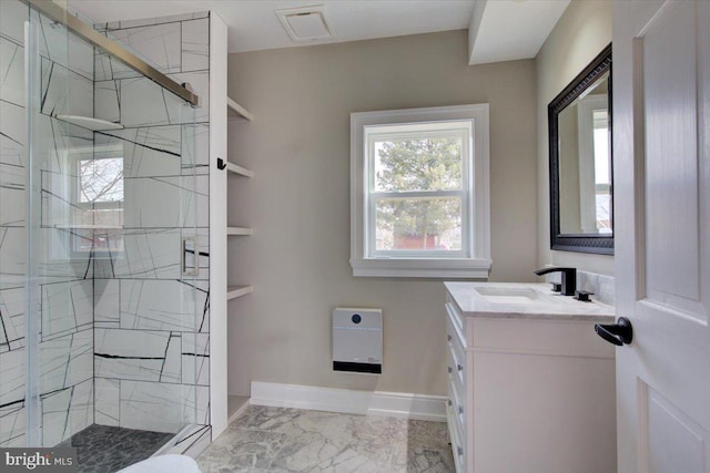 bathroom featuring baseboards, vanity, marble finish floor, and a shower stall