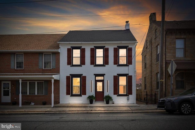 view of front facade featuring brick siding