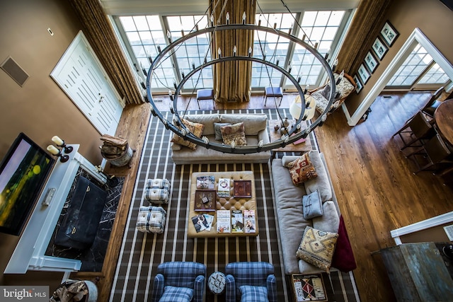 unfurnished living room featuring a healthy amount of sunlight and wood finished floors