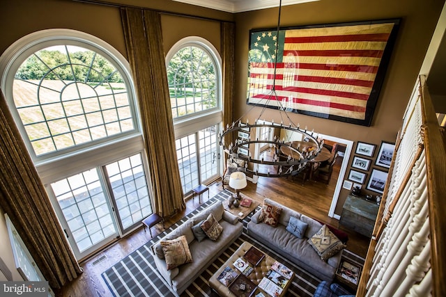 living room featuring visible vents and wood finished floors