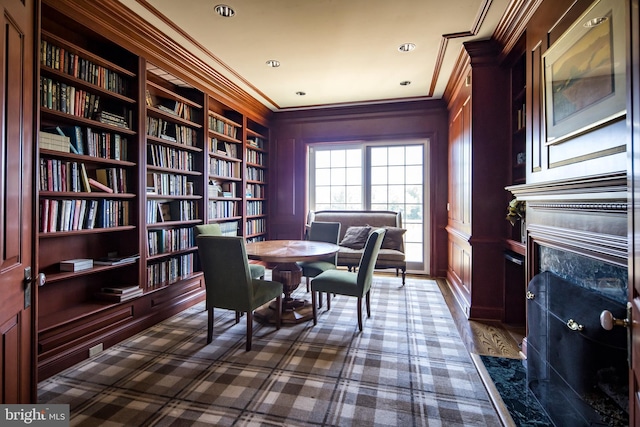 office area with built in features and ornamental molding