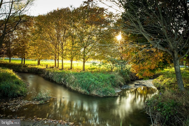 surrounding community with a water view