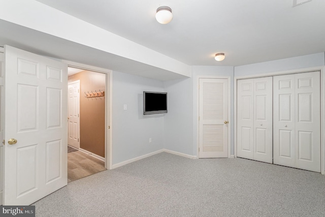 unfurnished bedroom with carpet and baseboards