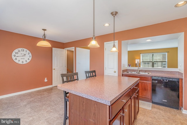 kitchen featuring a breakfast bar, a sink, a center island, brown cabinetry, and dishwasher