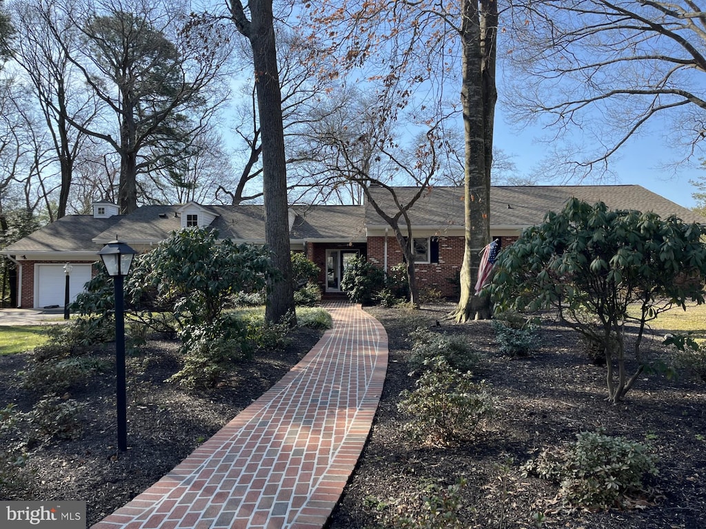 view of front of house featuring brick siding