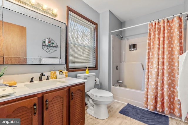 full bathroom with vanity, shower / bath combination with curtain, toilet, and wood finished floors